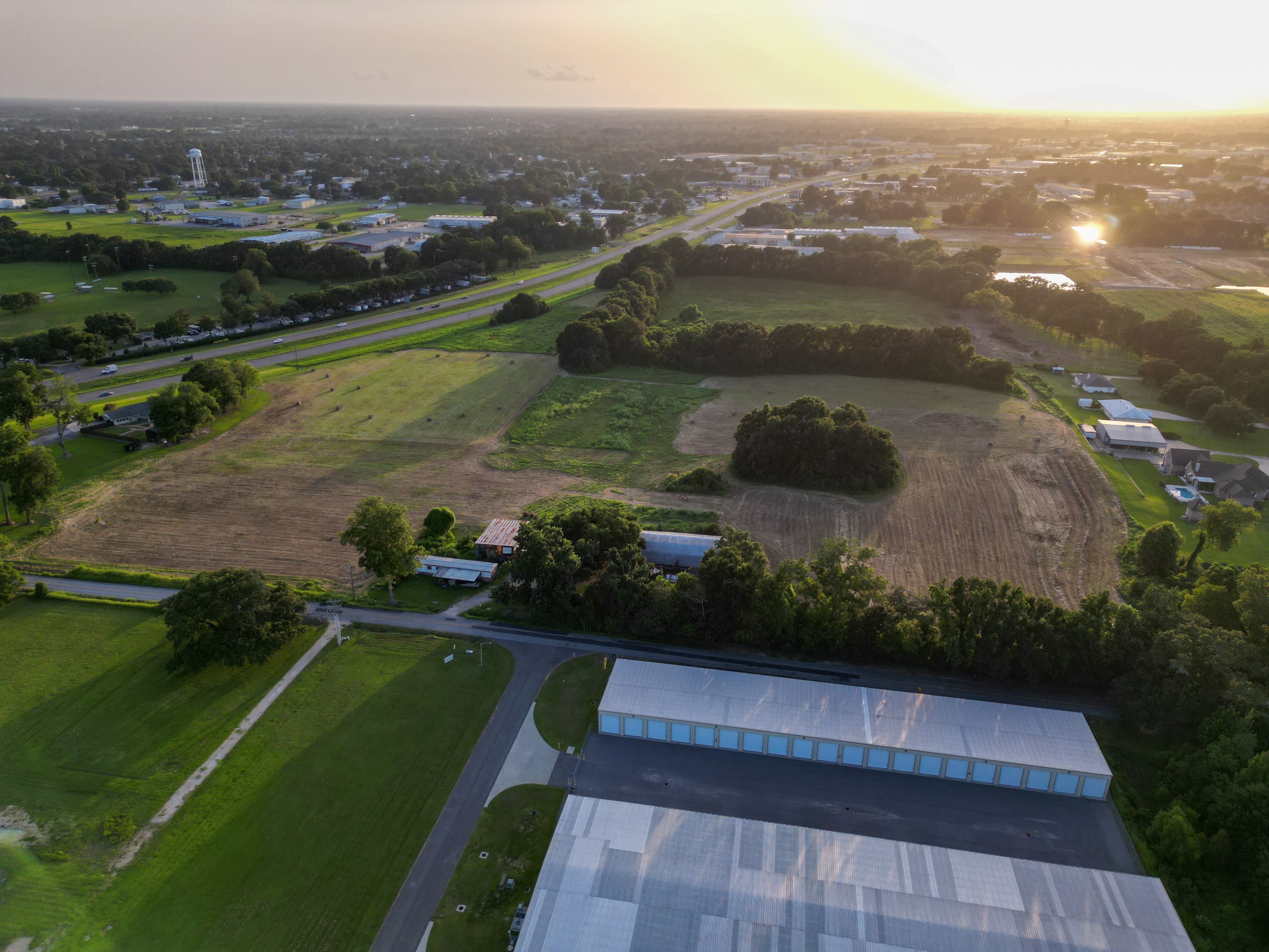 Sunset aerial overlooking the property and Broussard commercial corridor